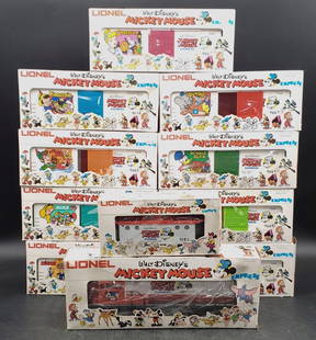 Lionel Mickey Mouse 11 Car Express Set: Lionel Express U 36B Diesel Engine, Box Cars, and Caboose. Boxes have some ware and corner ware.