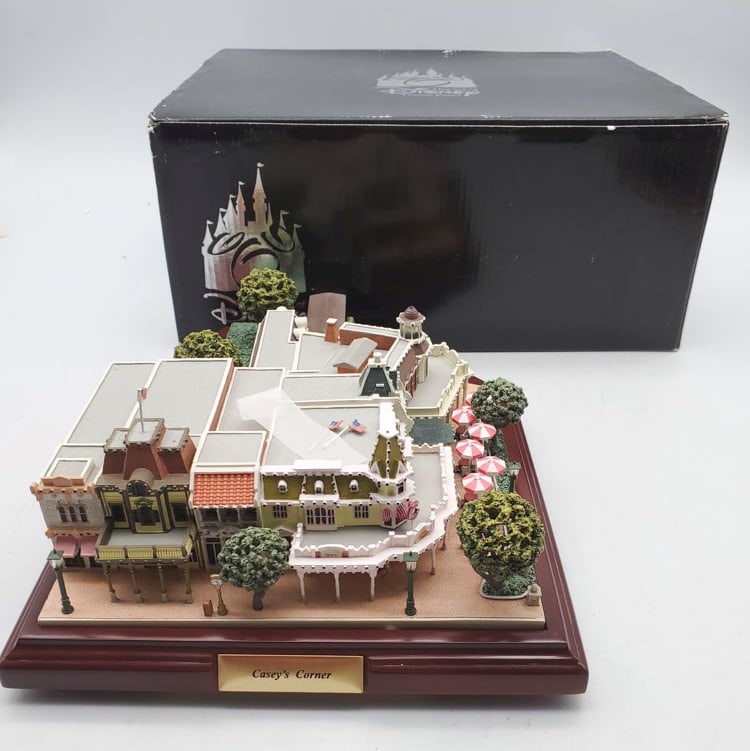 Disney Parks Casey?s Corner Olszewski First Edition: Sculpture measures 3 3/4” H x 8 1/2” W x 11”. Sculpture appears to be in overall good condition with original box. Box is in overall good condition with corner damage.
