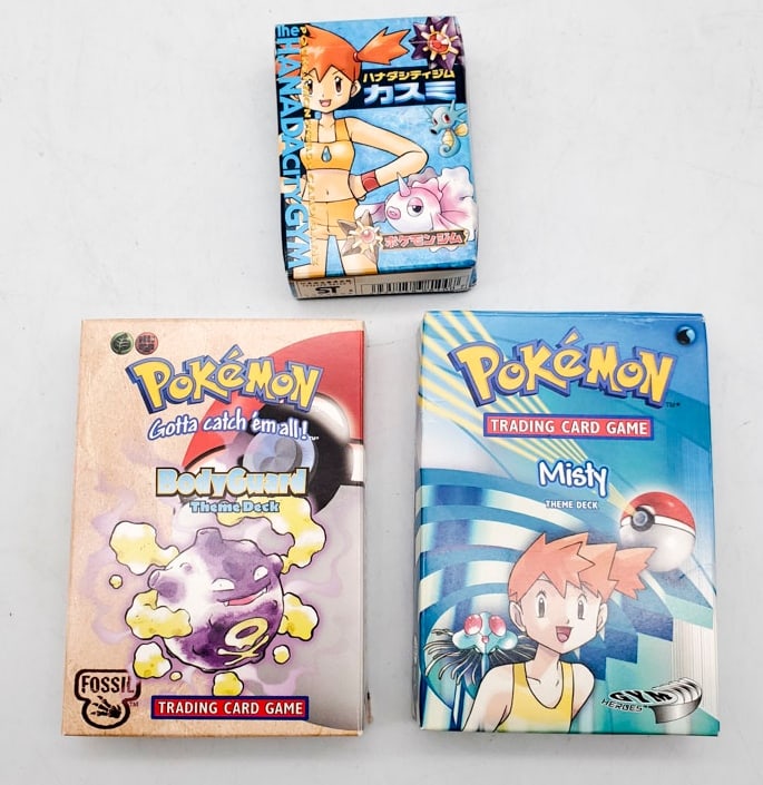 3 Pokémon Theme Decks including Misty, Japanese Misty, Bodyguard: Misty Theme Decks have Holographic Cards but Bodyguard Deck Don?t have holographic card. boxes are in overall good condition