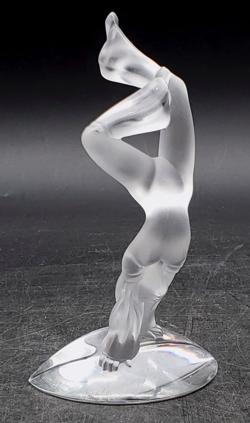 Lalique Figurine Acrobat "Legs Up": The glass figurine is in great condition with no chips or cracks. It is signed Lalique France in script on the back. It is 5-7/8" tall.