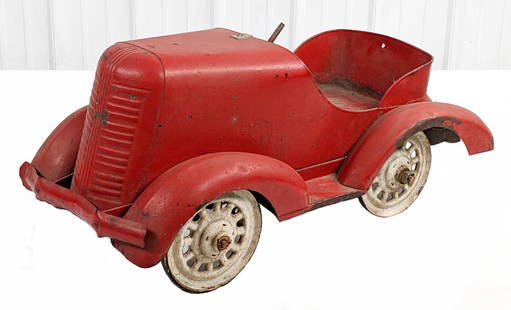 Garton Pontiac Pedal Car: Garton Pontiac pedal car. The car has an old overpaint done in red overall with white wheels. The car is missing the steering wheel, hood ornament, and hubcaps. The car has a small hole on the