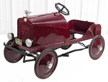Restored Toledo Juvenile Auto Studebaker Pedal Car: Restored Toledo Metal Wheel Co. Juvenile Auto Studebaker pedal car. The car has a wood frame, original front license plate, original Studebaker emblem, dummy shift lever, chrome hubcaps, and rear moun