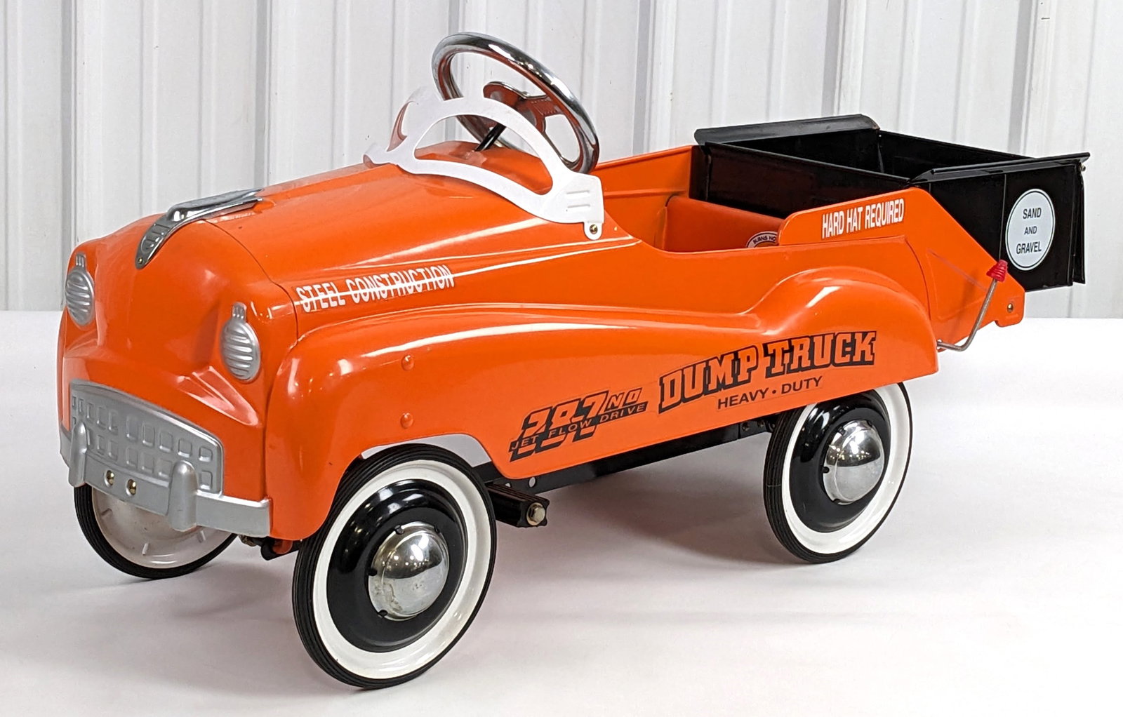 Contemporary Burns & Novelty Heavy Duty Dump Truck Pedal Car: Contemporary Burns & Novelty heavy duty dump truck pedal car. The truck is in good condition with minor scuffs and light wear from storage / display. Measures approximately 44" long.