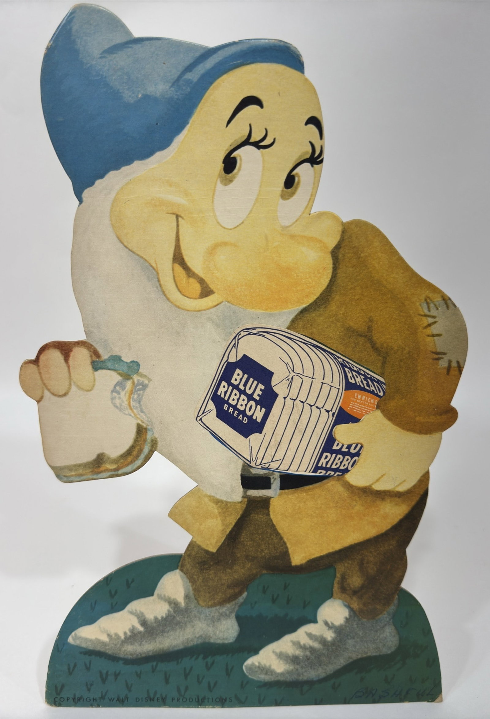 1950s Donald Duck Bread Disney Snow White Sign: Original 1950s Donald Duck Bread Disney Snow White Seven Dwarfs "Bashful " single sided die-cut cardboard easel back countertop advertising sign. Has fading / discoloration, creases,some damage to the