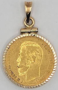 1900 Russia 5 Roubles Gold Coin In 8k Yellow Gold Bezel: 1900 Russia 5 Roubles Gold Coin in a 8k Yellow Gold Bezel. The coin is .900 fine and contains 3.87 grams of pure gold, the 8k bezel weighs 1.27 grams.