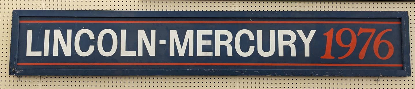 8ft 1976 Lincoln Mercury Dealership Sign: Large unique single sided 1976 Lincoln Mercury dealership sign. It features a wood frame and masonite / composite sign. Has paint loss , discoloration, and other wear from use and age. Measures approx