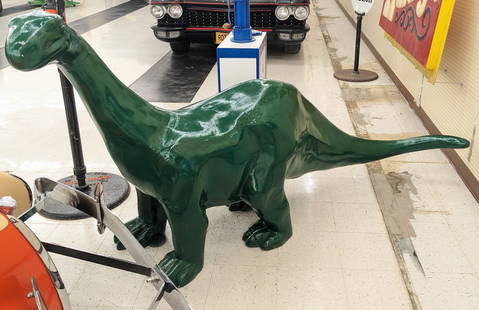 8ft Cast Metal Sinclair Gas Station Dino Statue: Giant cast metal Sinclair Dino statue. Appears to be in good condition with some paint loss and wear from display. Measures approximately 8ft across by 4ft tall.
