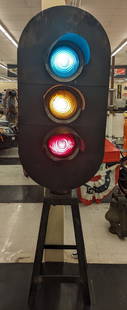 Vintage Railroad Signal Light W/ Custom Display Base: Vintage railroad signal light with custom metal display base. Appears to be in good working condition with an older repaint. Does have some paint loss and wear from display and age. Measures approxima