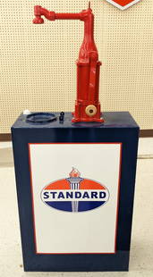 Restored Standard Oil Service Station Lubester: Restored vintage Standard Oil service station metal lubester. Appears to be in overall good condition with paint loss, scratches, dents, and wear from display. It measures approximately 52in tall by