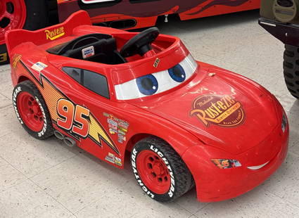 Lightning McQueen Battery Op Power Wheels: Disney Lightning McQueen power wheels battery op ride on. Has scuffs, decal wear, and other wear from play. Has been updated with a 24volt battery system. Measures approximately 51in across.