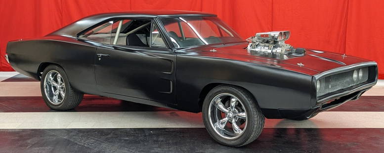 Fast & Furious Dominic Toretto's Screen Used 1970 Dodge Charger R/T: This car was used in both Fast & Furious 4 and the beginning of 5. Car has a completely stripped interior with an added roll cage, and racing instrument cluster. Interior door panels and other panels