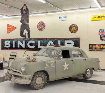 Indiana Jones & The Crystal Skull 1950 Ford Deluxe US Military Sedan: This car was used during the filing of the award winning scene in the opening of the movie where you see the reflection of the racing car in the hub cap. Harrison Ford rode in the trunk of this car wh