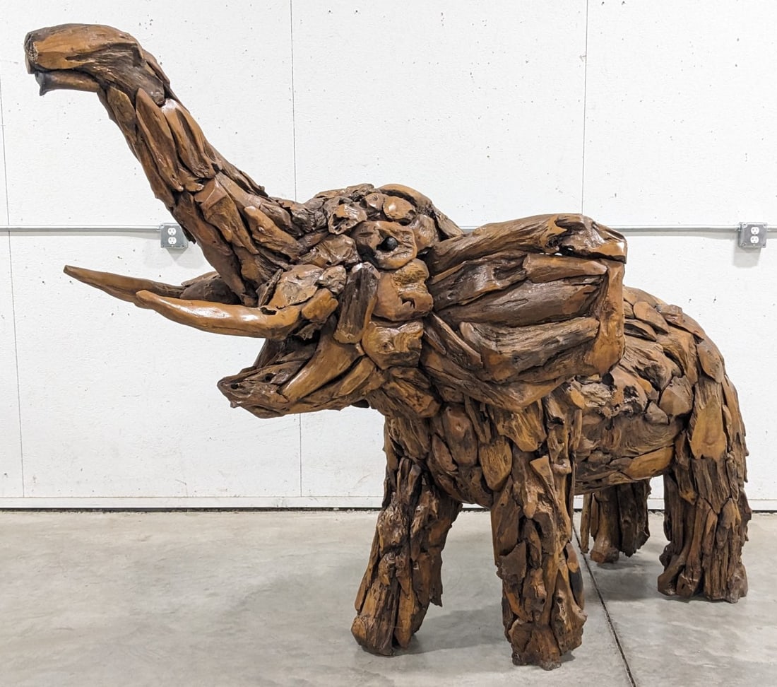 9ft Long Teak Wood Elephant Sculpture: 9ft Long Teak Wood Elephant Sculpture.? Very large sculpture featuring a carved wood face, tusks, feet, and other details made of teak wood. A nice unique piece for any African safari room. Overall me