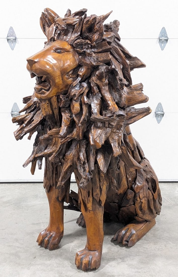 5ft Tall Teak Wood Regal Sitting Lion Sculpture: 5ft Tall Teak Wood Regal Sitting Lion Sculpture.? Sculpture features a carved wood face, paws, and other details made of teak wood. Piece is in very nice condition with a lot of details. Overall measu