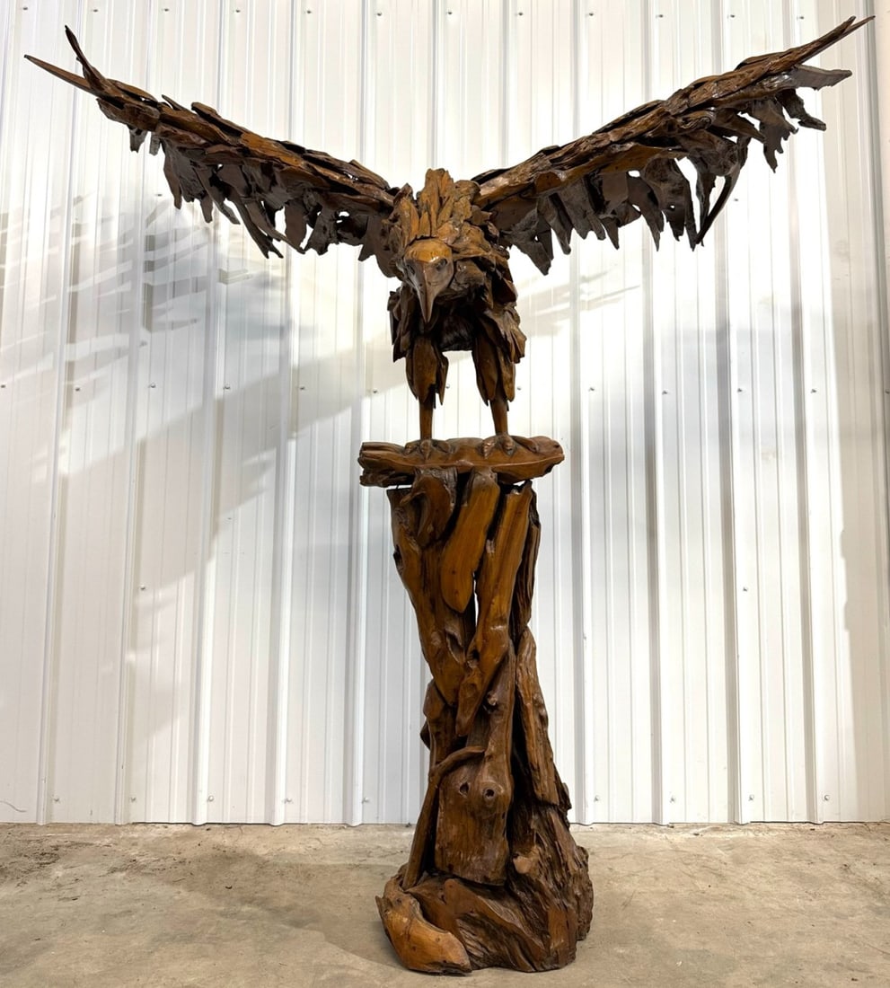 7.5ft Tall Teak Wood Eagle Sculpture: 7.5ft Tall Teak Wood Eagle Sculpture. This incredible sculpture is full of so much amazing detail. It is complete with a carved wood face and feet. It is in nice condition overall and measures approxi