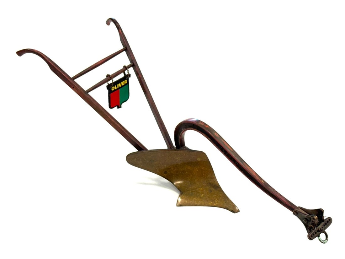 Salesman Sample Oliver Walking Plow: Salesman Sample Oliver Walking Plow. Plow has Brass Plow and Metal Body with Oliver inscribed on side and wooden handles. Plow is in overall good condition with some wear from age.? Measures 22 1/2" l