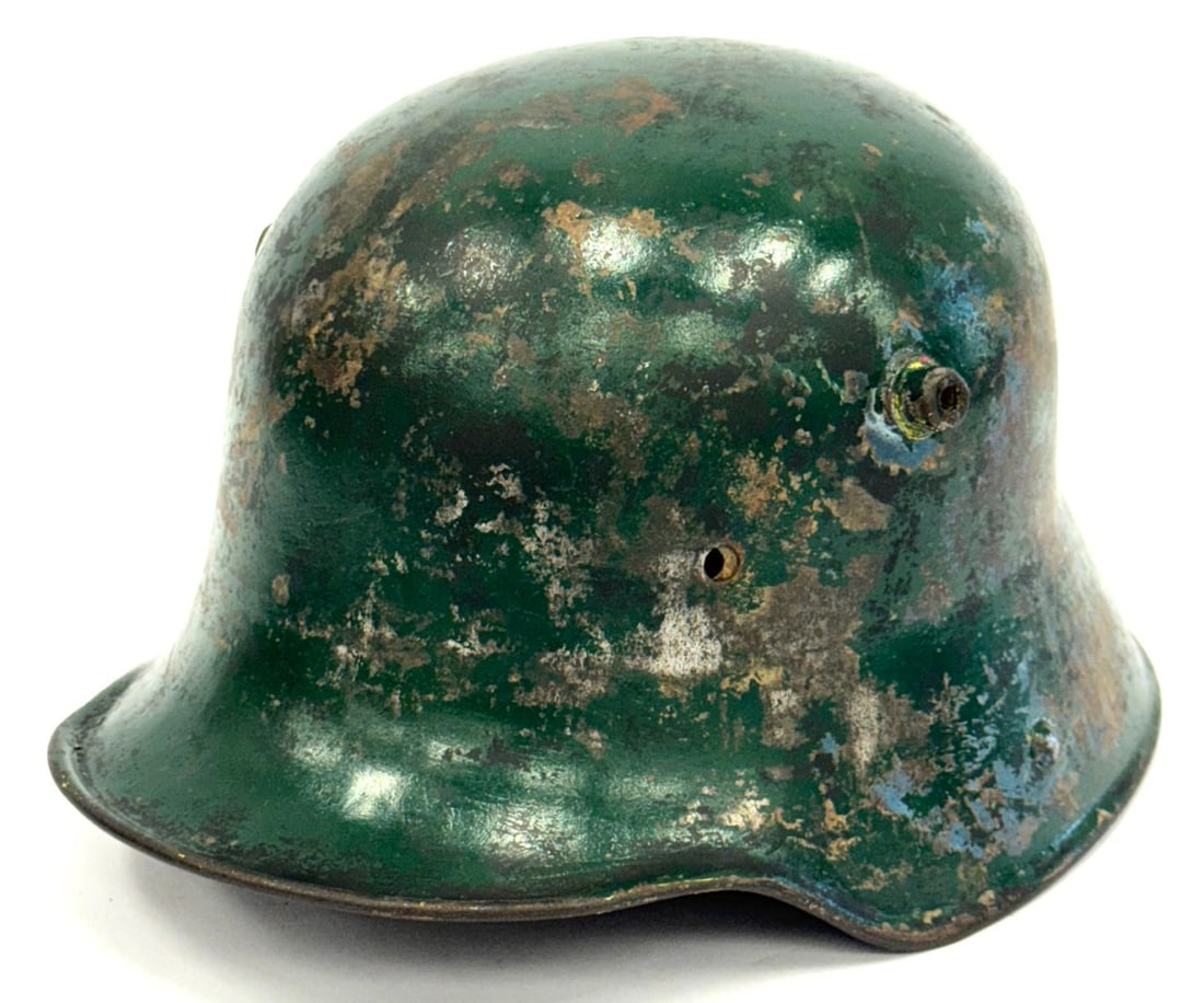 WW I German M16 Helmet No Liner: WW I German M16 Helmet No Liner. Exterior appears to have been painted with green paint post war?