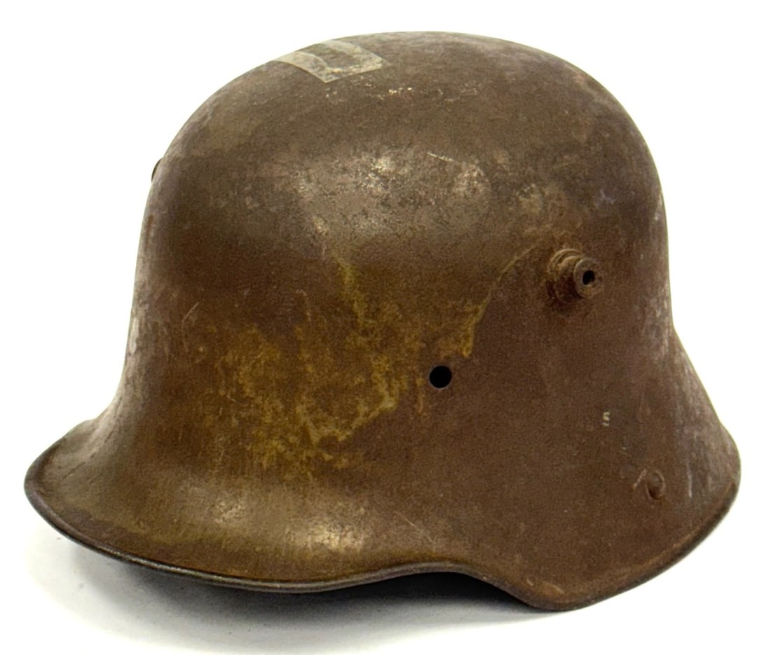 WW I German M16 Helmet No Liner: WW I German M16 Helmet No Liner. Appears to Have Battle Damage in the Form of a Bullet Hole. Surface level rust on exterior and interior.