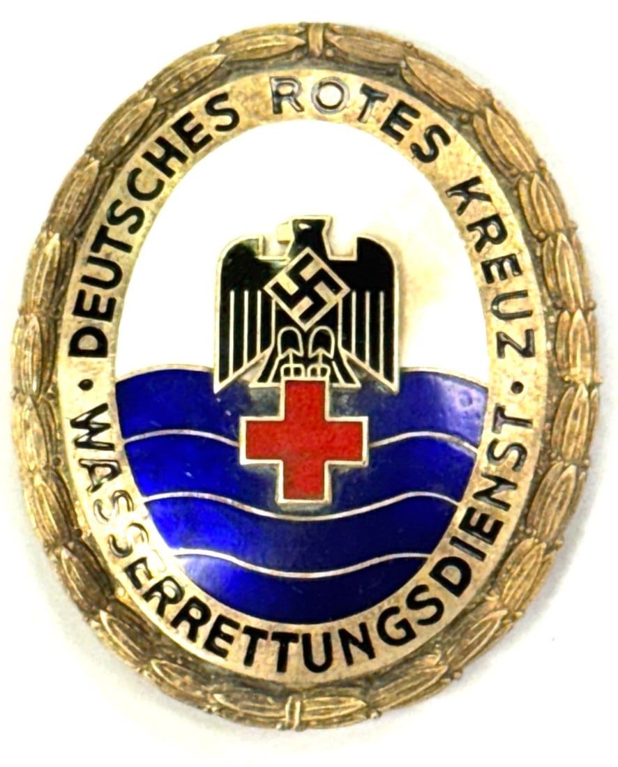 German WW2 Red Cross Water Rescue Breast Badge: German WW2 Red Cross Water Rescue Breast Badge. Badge has inscription on back 1306 Ges.Gesch. Badge measures 2" x 2 1/2"