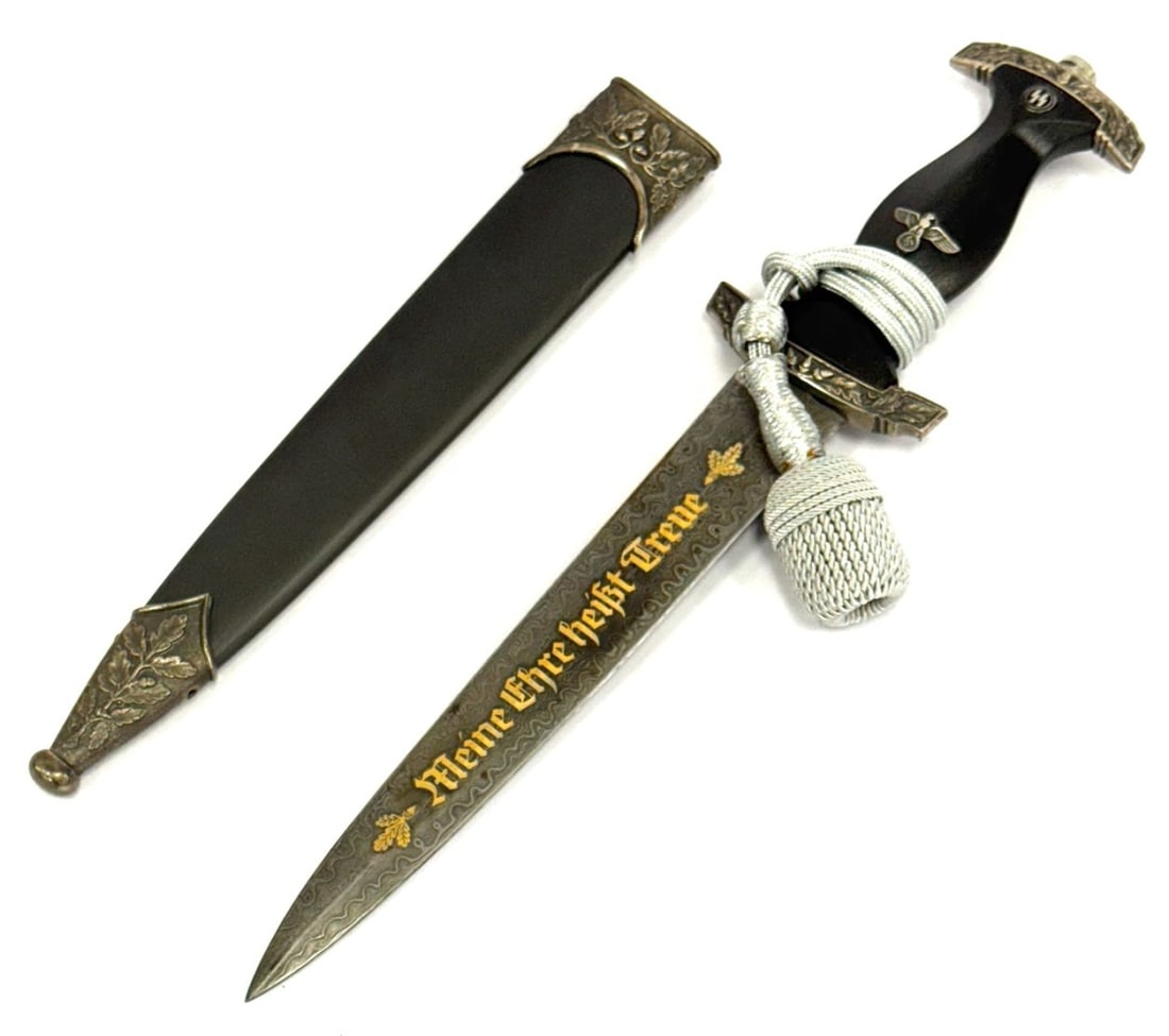 Reproduction German WW II SS Honor Dagger: Reproduction German WW II SS Honor Dagger.? Reproduction Dagger Displays Nice, Does Not Completely Fit Into Scabbard. Tang Nut Does not Seat Completely and Top Crossguard Fits Loosely.? Blade Measures