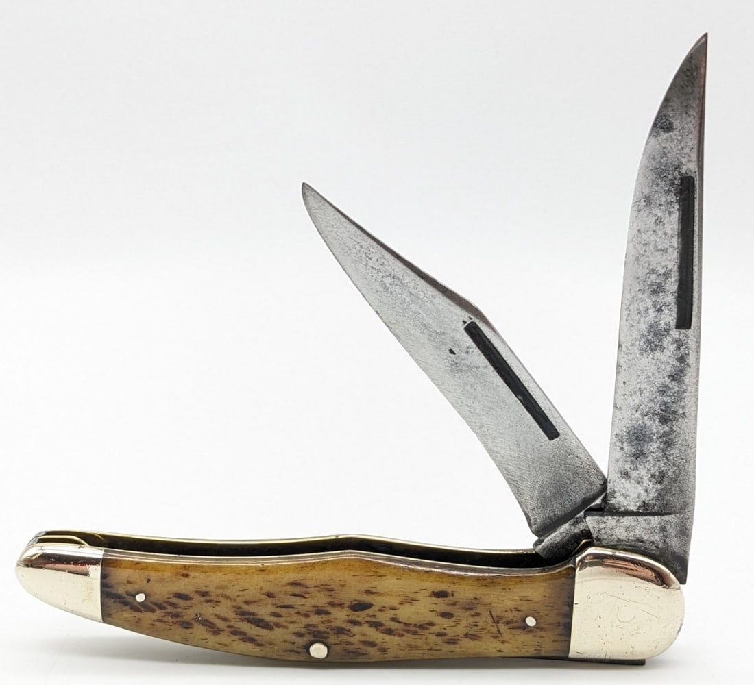 1920-40s Kinfolks Jig Bone Rat Tail Folding Hunter 6292: Knife is in fair aged cleaned condition with heavy material loss and scratches on the blades, scuffs and dents on the polished bolsters, and good pocket worn handle scales. Overall measures 5-1/4in wh