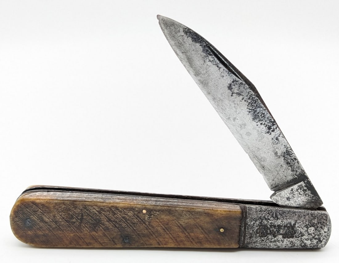 Hibbard Spencer Bartlett & Co Smooth Bone Grand Daddy Barlow 061: Knife is in aged condition with heavy cleaned pitting and scratches on the blade, heavy cleaned pitting on the bolster, and good handle scales with pitting on the leaf spring. Overall measures 5in whe