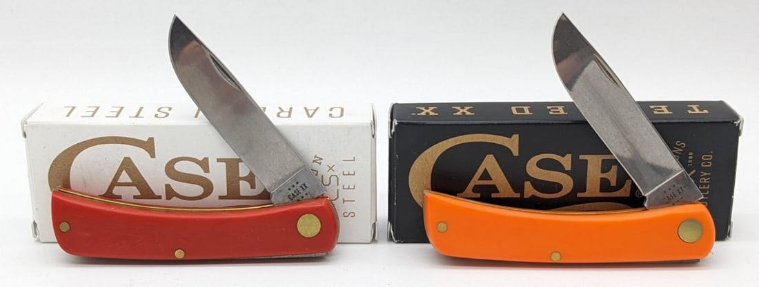 (2) 2024 Case XX Synthetic Red & Orange Sod Buster Jr's w/ Boxes 4137: Knife is in very nice condition with minimal wear from handling. Overall measures 3-5/8in when closed.