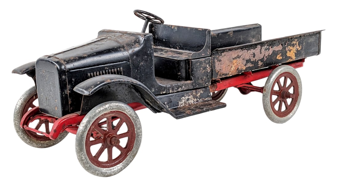 Buddy L Express Truck: Buddy L Express Truck. The truck is missing the fenders and tailgate. The truck has rust damage, overpaint, and wear from play / age. Measures approximately 24" long.