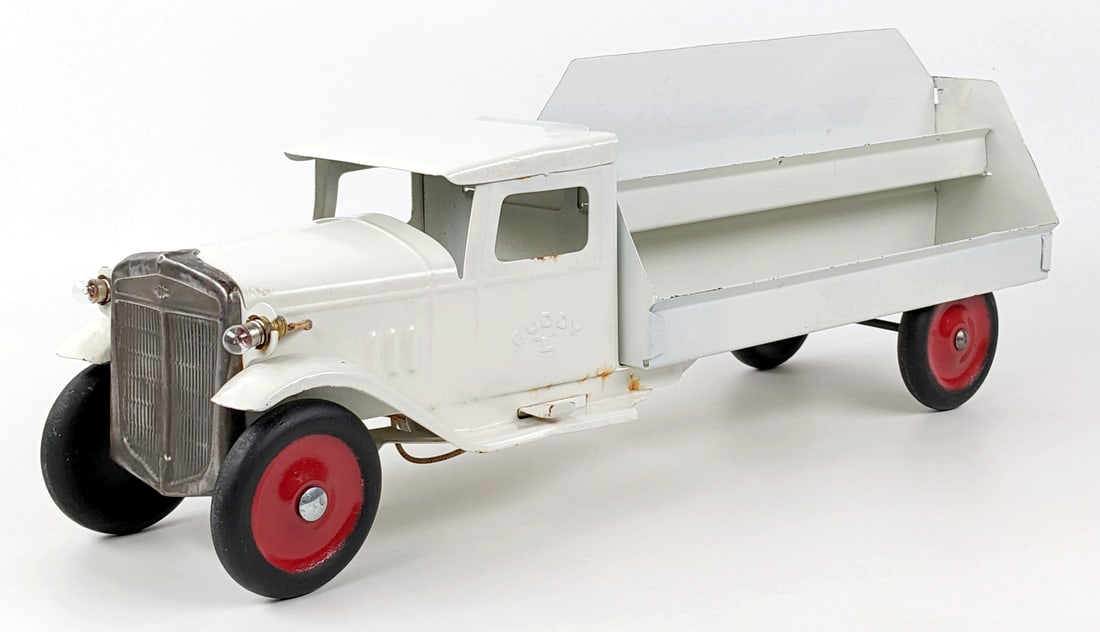 Restored Buddy L Motor Market Delivery Truck: Restored Buddy L Motor Market delivery truck with electric headlights. The truck has some edge wear and some surface rust behind the cab. The truck could benefit from adding decals. Measures approxima
