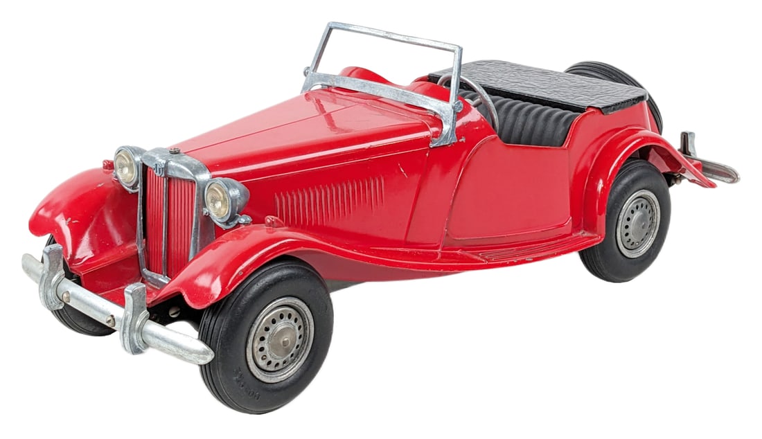 Doepke MG Roadster: Original Doepke MG Roadster. The car is in good condition overall with some small paint chips and minor edge wear. Displays well. Measures approximately 15" long.
