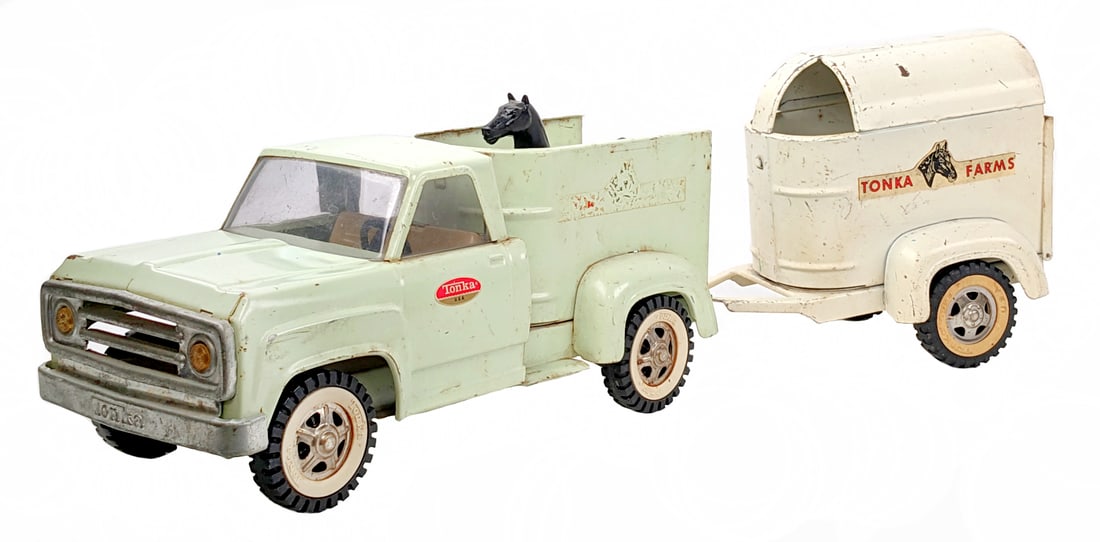 Original Tonka Farms Horse Truck & Trailer: Original Tonka Farms horse truck and trailer. The truck and trailer have some discoloration, decal loss, paint loss, and wear from play / age. It does come with one horse. The trailer is missing one o