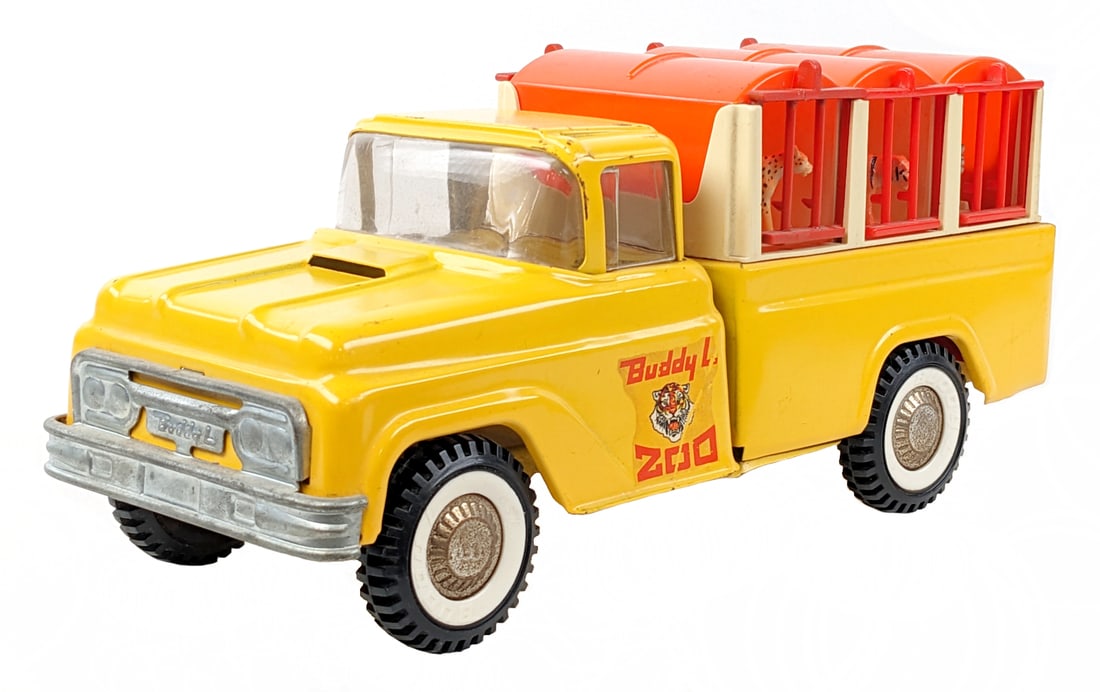 Original Buddy L Zoo Truck: Original Buddy L Zoo truck. The truck has some paint loss, decal loss, and oxidation to the hubcaps. Some of the plastic cage doors have some damage. The truck comes with 6 different animals. Measures