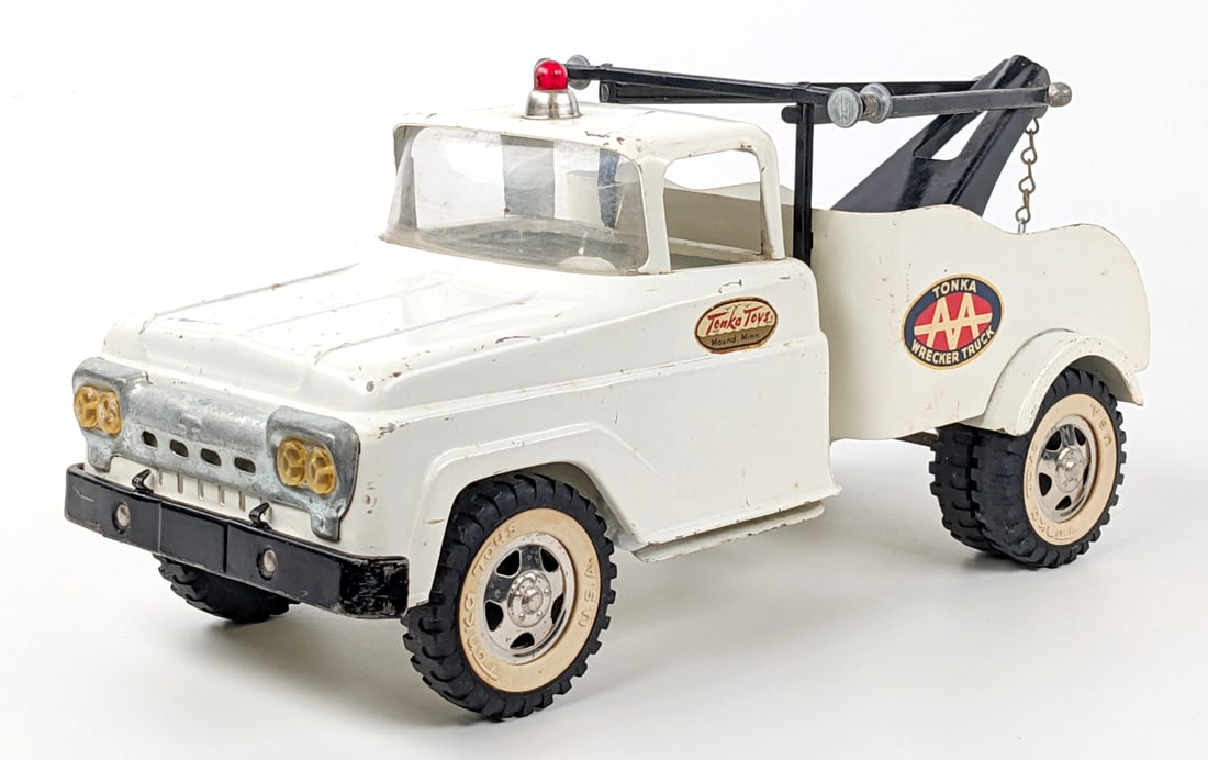 Original Tonka AA Wrecker Tow Truck: Original Tonka AA wrecker tow truck. The truck has some paint loss and light war from play / age. Measures approximately 13" long.