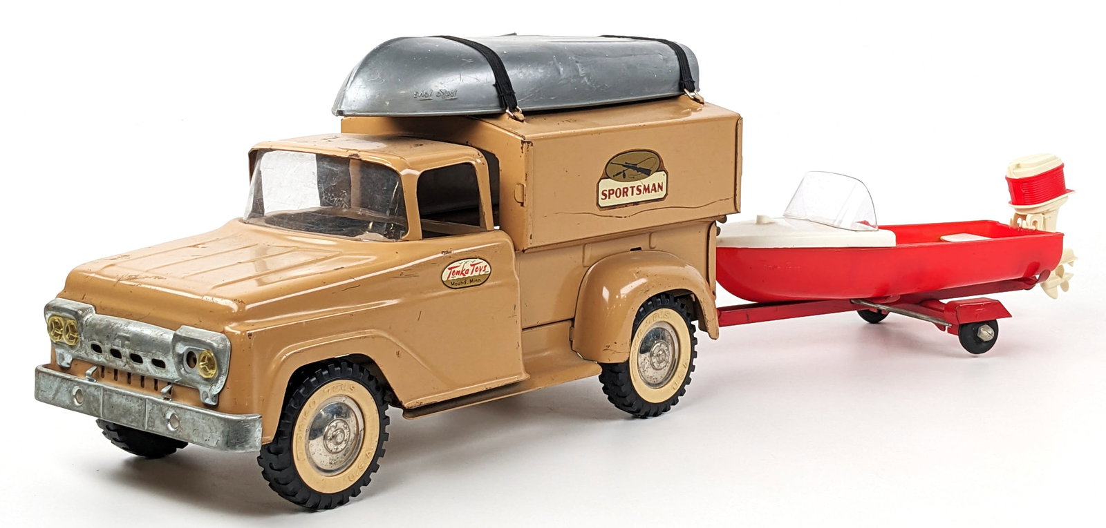 Tonka Sportsman Truck w/ Boat Trailer, Boat & Outboard Motor: Original Tonka Sportsman truck. The truck would have not originally came with the boat and trailer. The gray boat has a small hole in it and the red boat has a repair under the rear bench. The straps 