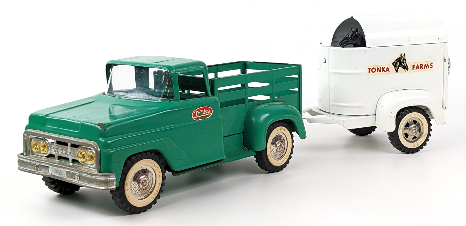 Original Tonka Stake Truck w/ Horse Trailer: Original Tonka stake truck with horse trailer. A harder truck to find in the all green color. The hubcaps on the trailer and truck don't match meaning they wouldn't have originally came together. Howe