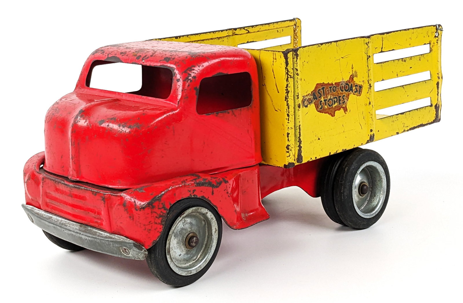 Original Tonka Coast-To-Coast Delivery Truck: Original Tonka Coast-To-Coast delivery truck. The truck has paint loss, scratches, and wear from play / age. The rear chain was replaced. Measures approximately 12" long.