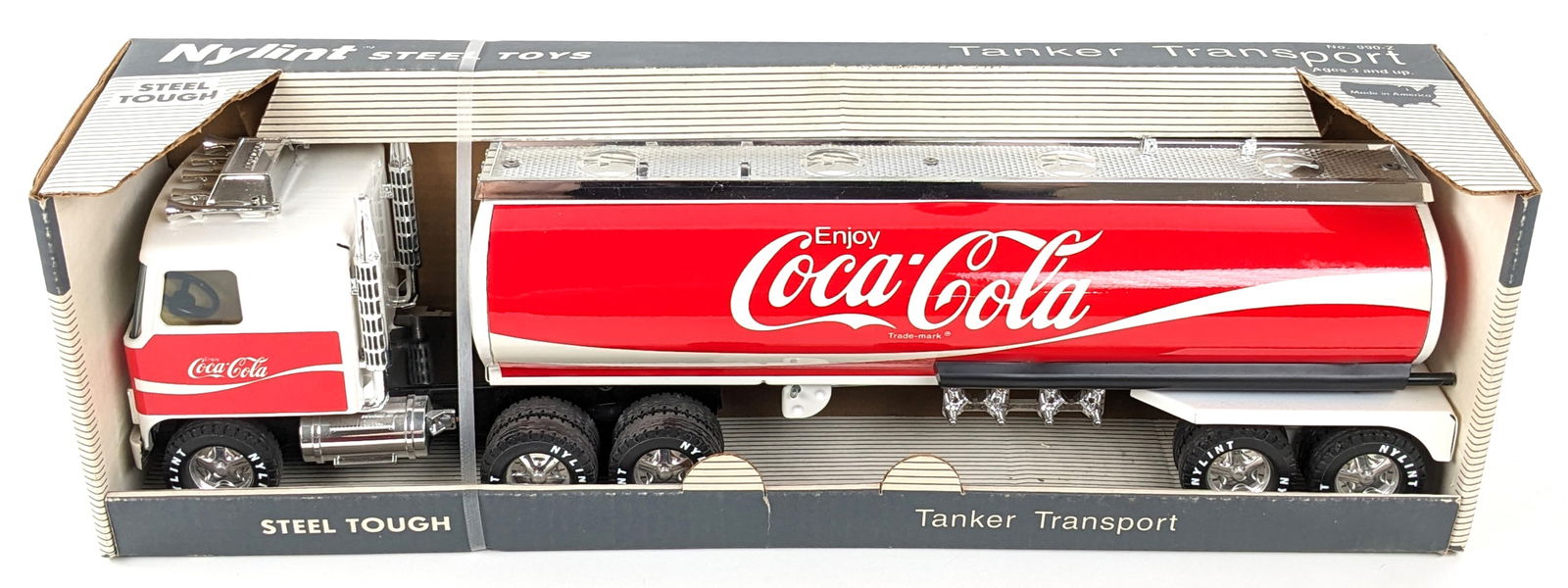 Nylint Coca-Cola Tanker Transport Truck In Box: Nylint Coca-Cola tanker transport truck in the original box. Very good condition overall new in the box. Box shows minor storage wear. Measures approximately 22" long.