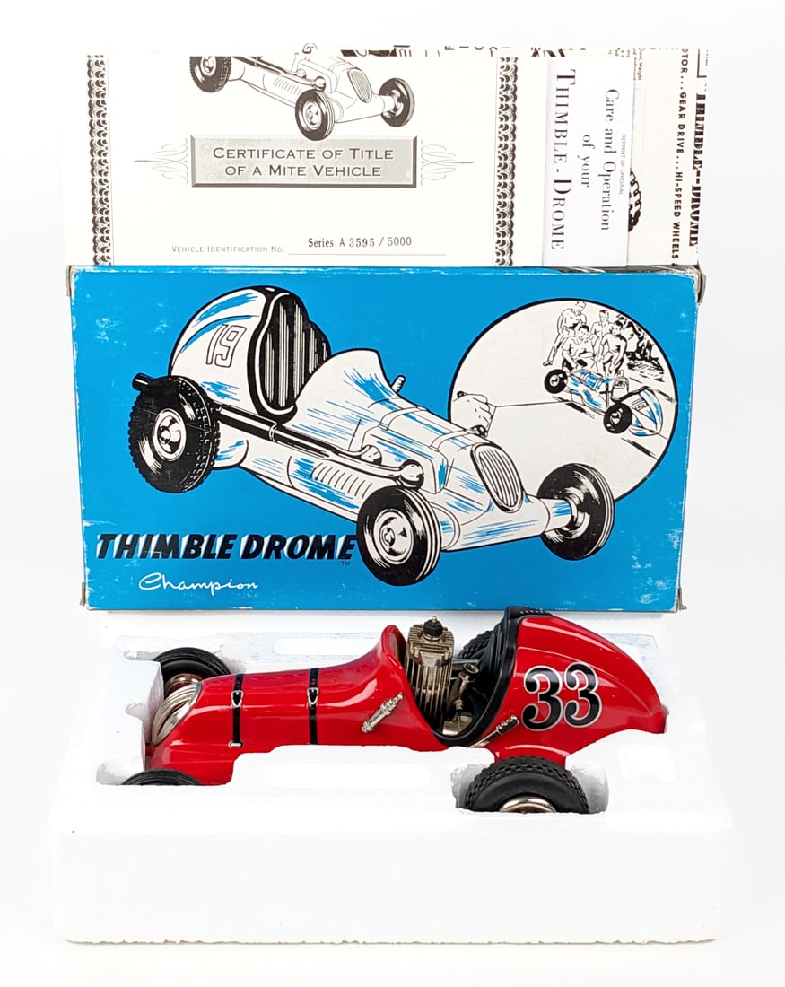 Nylint Thimble Drome Champion #33 Tether Car: Contemporary Nylint Thimble Drome Champion #33 tether car. The car has a small paint chip. It comes with the paperwork. The box has wear from handling / storage. Limited edition #3595 of 5000. Measure