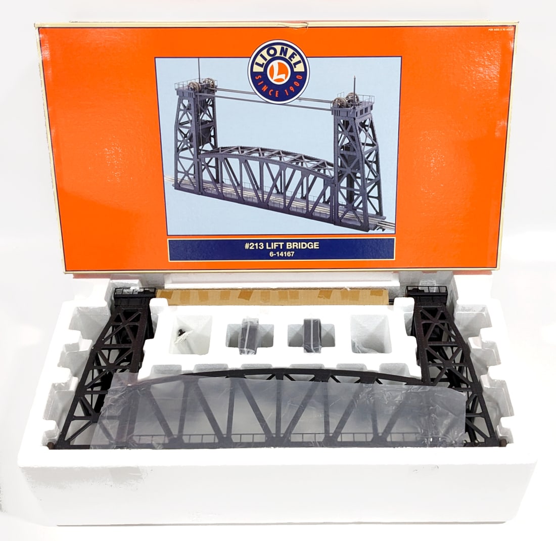 Lionel #213 Lift Bridge 6-14167: Lionel modern #213 lift bridge. Good condition new in the box never displayed. The box has a small crushed spot on the top edge, but otherwise excellent. Approximately 26-1/2" x 5" x 15". Item No. 6-1