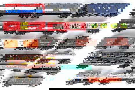 (18) Miscellaneous O Gauge Train Cars: (18) Miscellaneous O Gauge train cars. Includes mint cars, car carriers, tank cars, caboose, and other cars. The cars show dust and wear from use, age, and display.