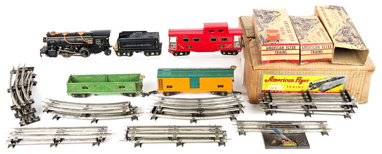 Prewar American Flyer No. 306 Train Set in Box: Prewar American Flyer No. 306 train set in the original box. The set includes 420 steam loco, 421 American Flyer Lines tender, 407 sand car, 408 boxcar, 411 caboose, and track pieces. Individual boxes