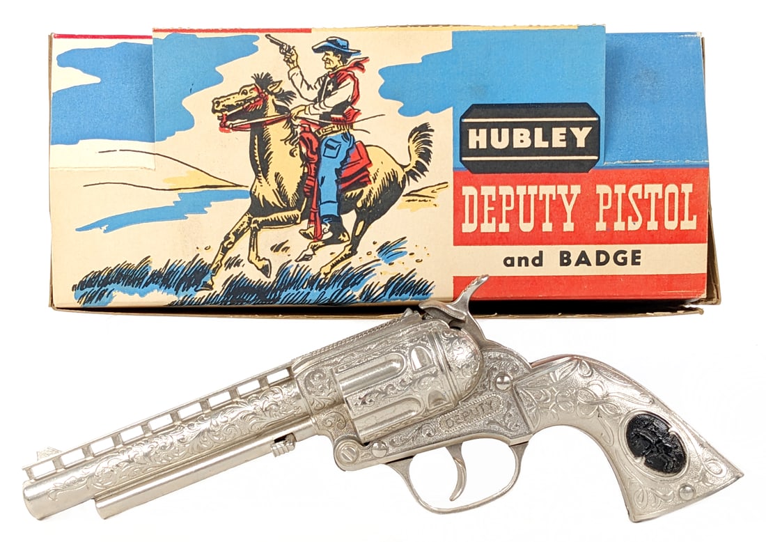 Hubley Deputy Cap Gun w/ Badge In Box: Hubley Deputy cap gun with badge in the original box. The gun is in excellent condition overall and works as it should. The box is great with a few small tears and even comes with the original plastic