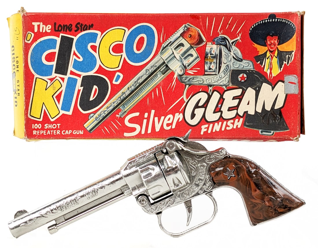 The Lone Star Cisco Kid Cap Gun w/ Box: The Lone Star Cisco Kid cap gun in the original box. The box is marked Made in England. The gun is in excellent shape almost appearing unfired. The box has started to separate at the seam and is missi