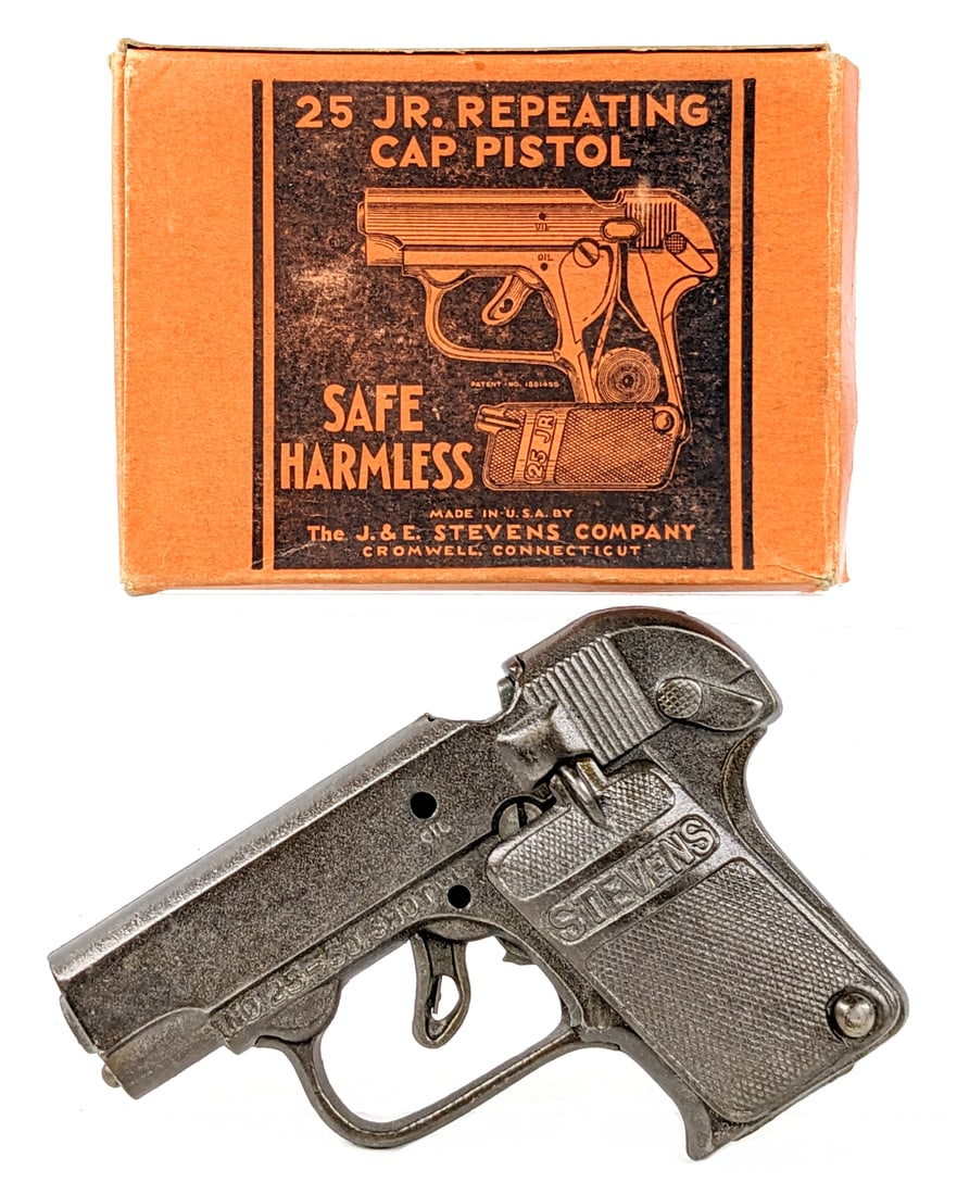 Stevens 25 Jr. Repeating Cap Pistol w/ Box: Stevens 25 Jr. repeating cap pistol with the original box. The cap gun is in great condition and appears to work as it should. The box has some staining and minor wear from age. Measures approximately