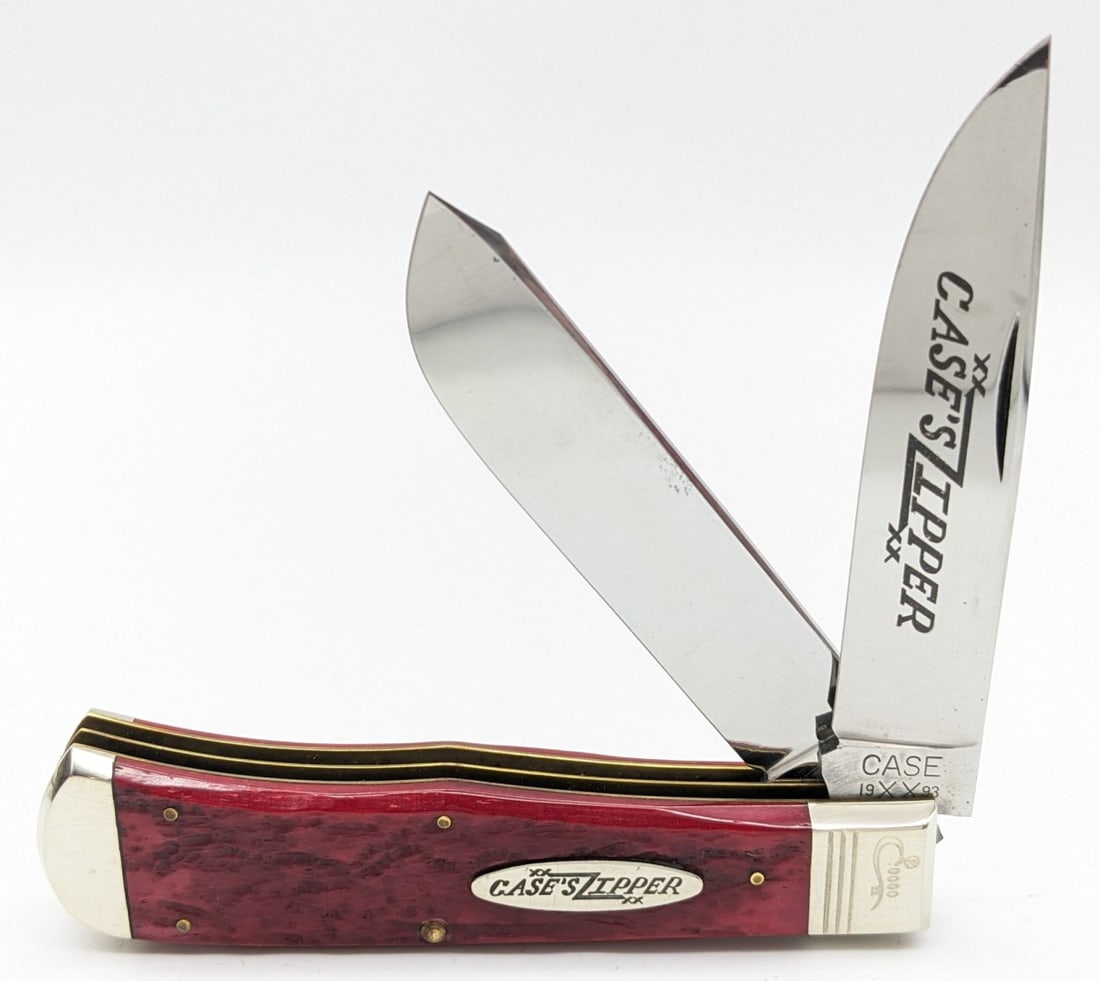 1993 Case XX Classic #0000 Red Banana Bone Zipper Trapper 6223: Knife is numbered 0000, and is in very nice condition with light scuffs from handling and a few tarnish spots on the secondary blade. Document COA has hand writing on it that has not been verified. Ov
