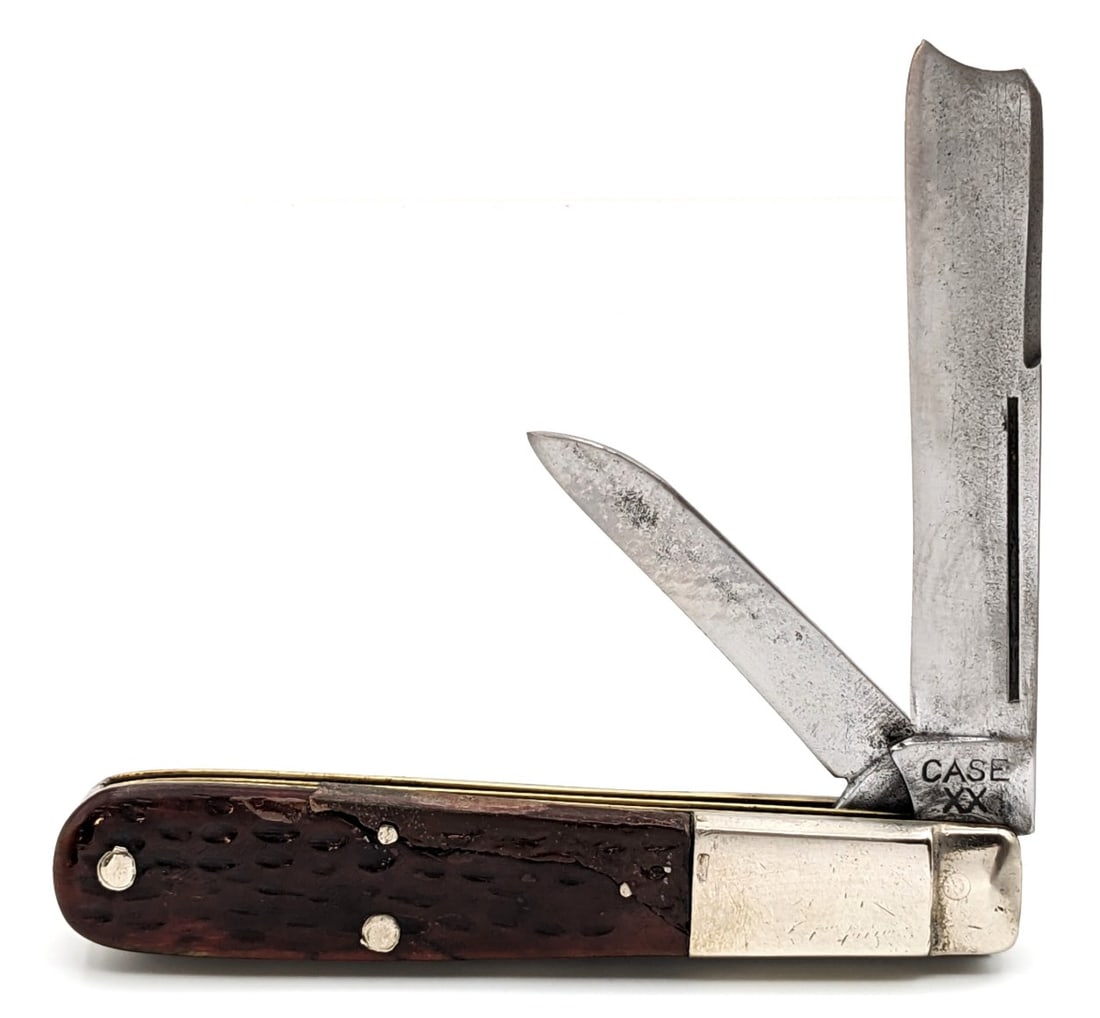1940-64 Case XX Jigged Bone Razor 6205R: Knife is in fair condition with material loss and pitting on the blades, scuffs and dings on the polished bolsters, and pocket worn handle scales with a large repair that is very loose. Overall measur