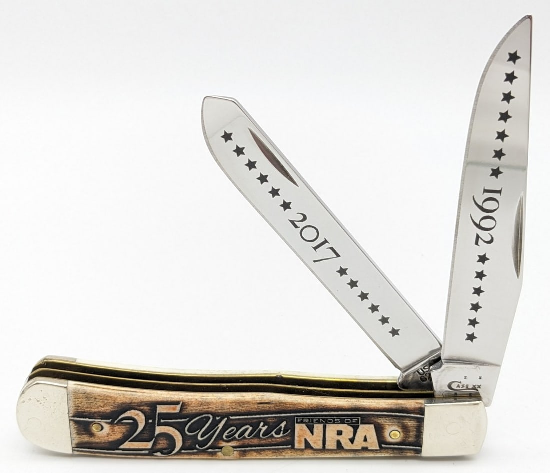 2016 Case XX 25 Year Friends of the NRA Smooth Bone Trapper 6254: Knife is in very nice condition with light scuffs and tarnish on the bolsters from handling. Overall measures 4-1/8in when closed.