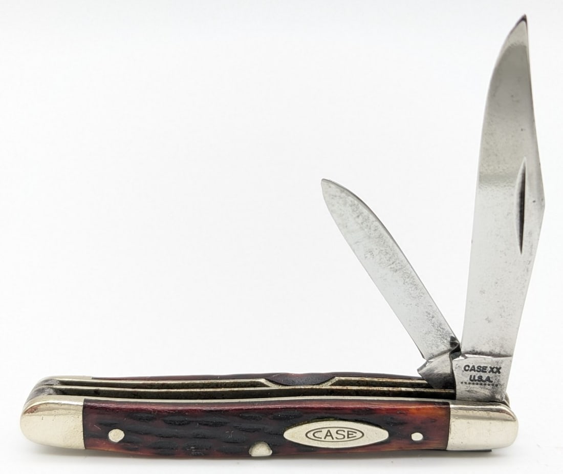 1970 Case XX Jig Bone Small Jack Knife 6227: Knife is in good condition with traces of pitting and material loss on the polished blades, scratches and dings on the polished bolsters, and nice handle scales. Overall measures 2-3/4in when closed.