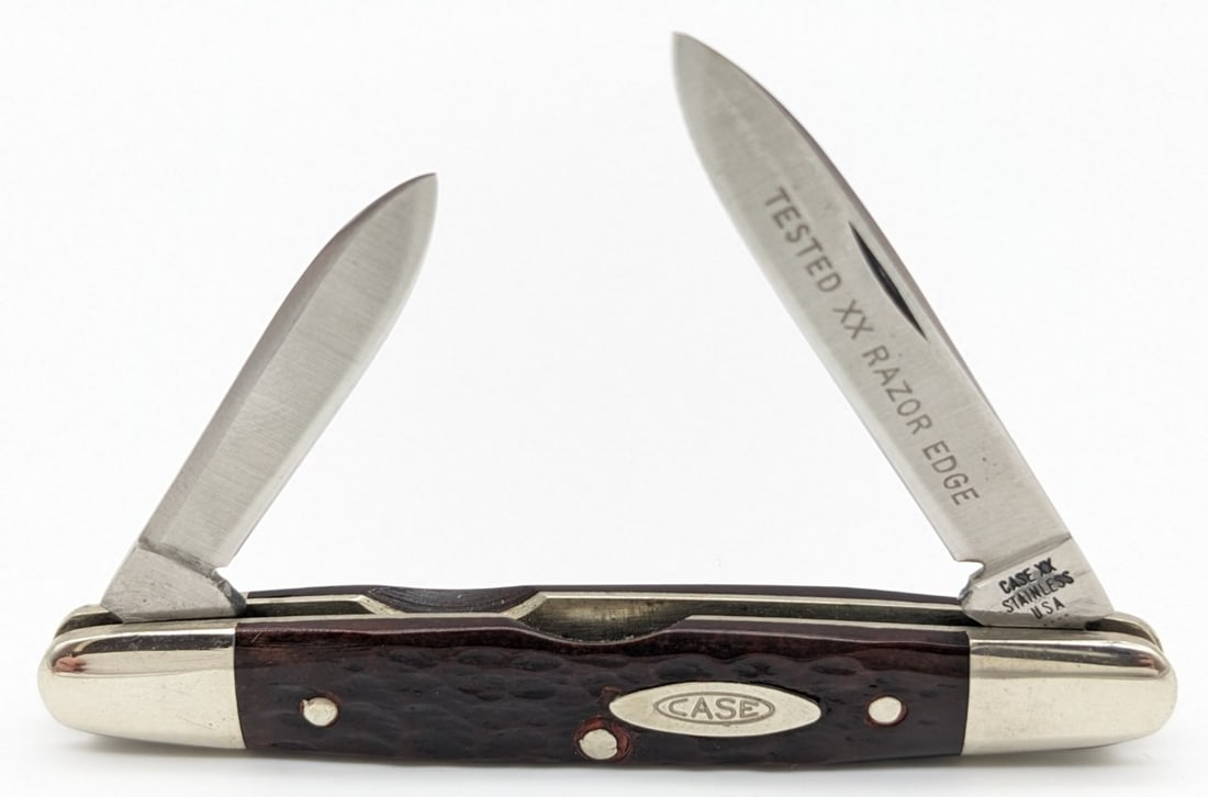 1975 Case XX Jigged Bone Eisenhower 06263: Knife is in very nice condition with minimal scuffs and tarnishing on the bolsters from handling. Overall measures 3-1/8in when closed.