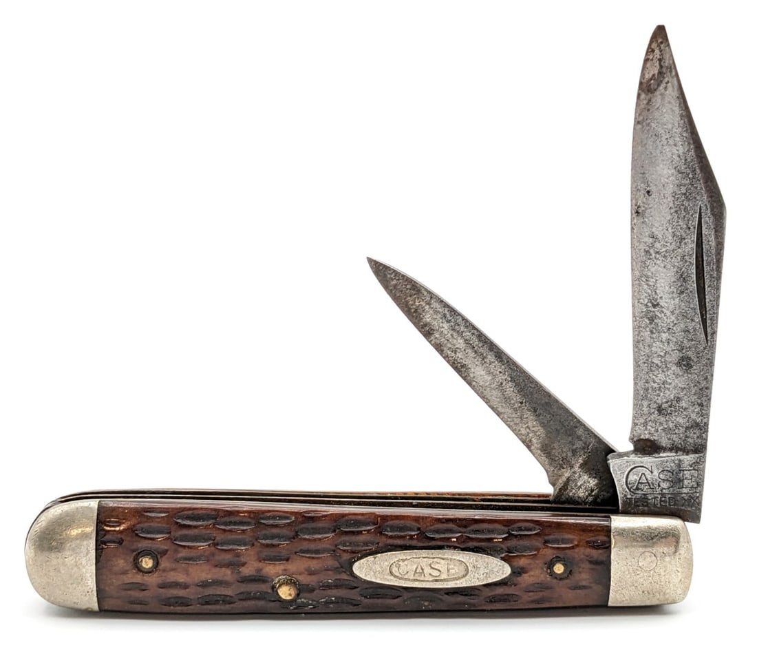 1920-40 Case Tested XX Jigged Green Bone Jack Knife: Knife is in aged condition with material loss and light pitting on the blades, scuffs and tarnishing on the bolsters, and a large chip out of the back handle scale. Overall measures 3-3/8in when close